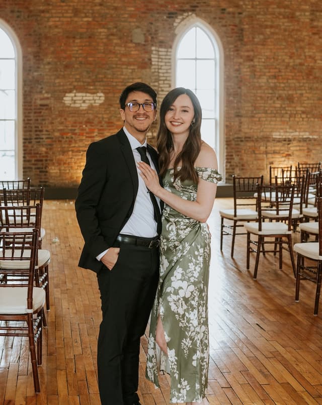 Jenn & Fern smiling at a wedding